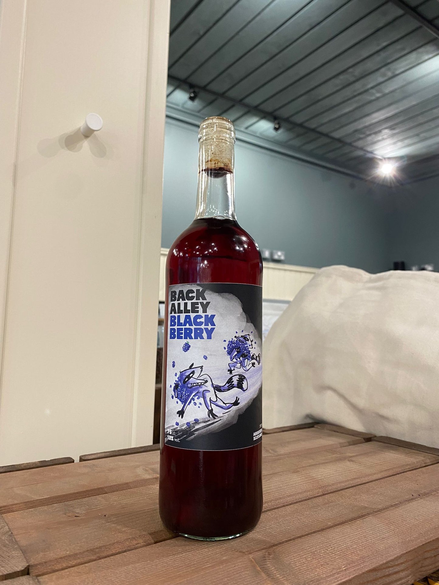 Two raccoons blackberry wine